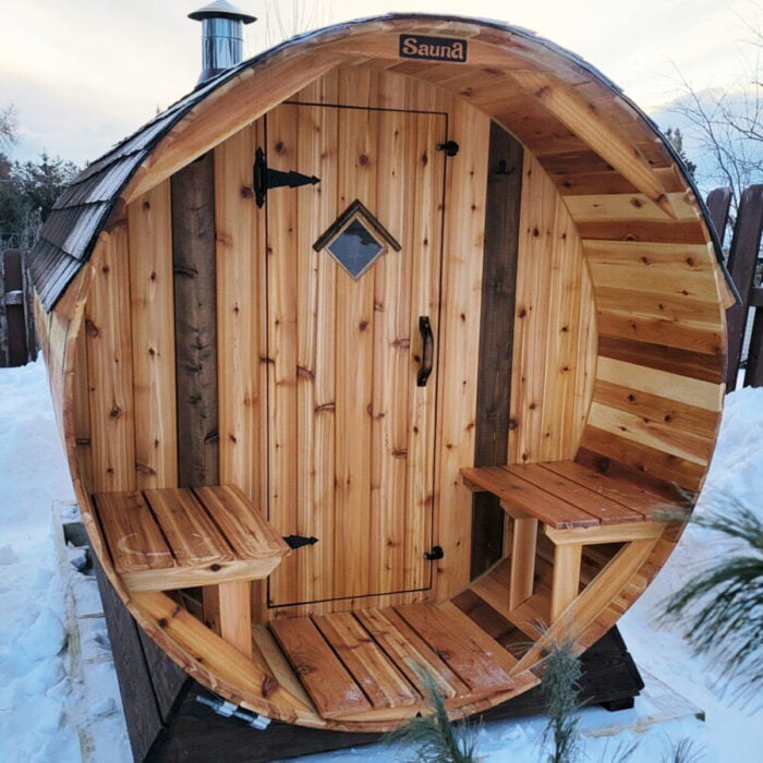 6-Person Barrel Sauna with Front Porch – spacious home sauna featuring covered porch and authentic cedar barrel design