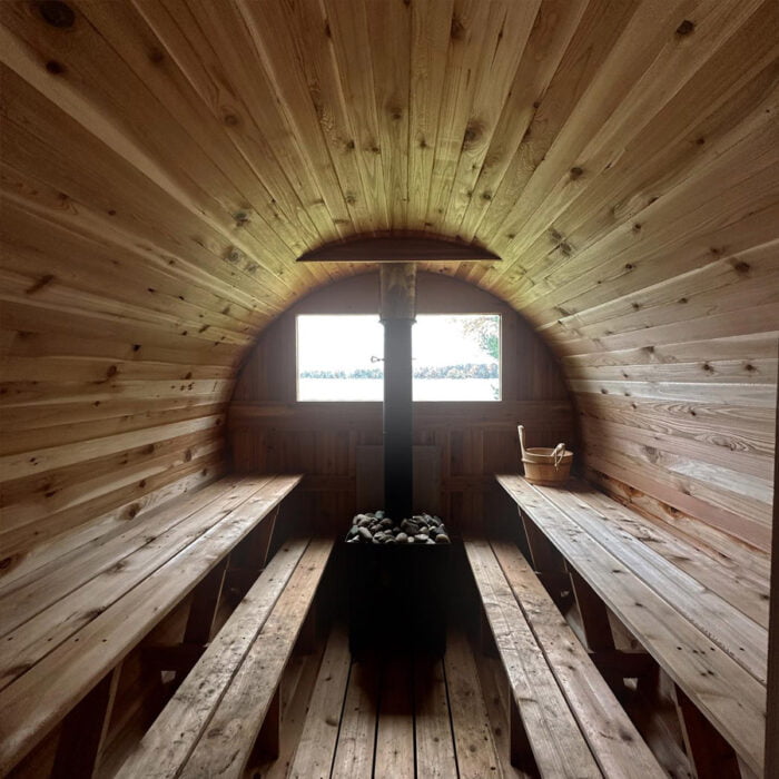 7' x 12' 8-Person Barrel Sauna with Changing Room – spacious wet sauna interior featuring two-tier benches and premium cedar construction