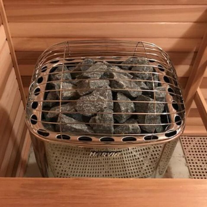Harvia Club K10G electric sauna heater with built-in controls in a cozy wooden sauna