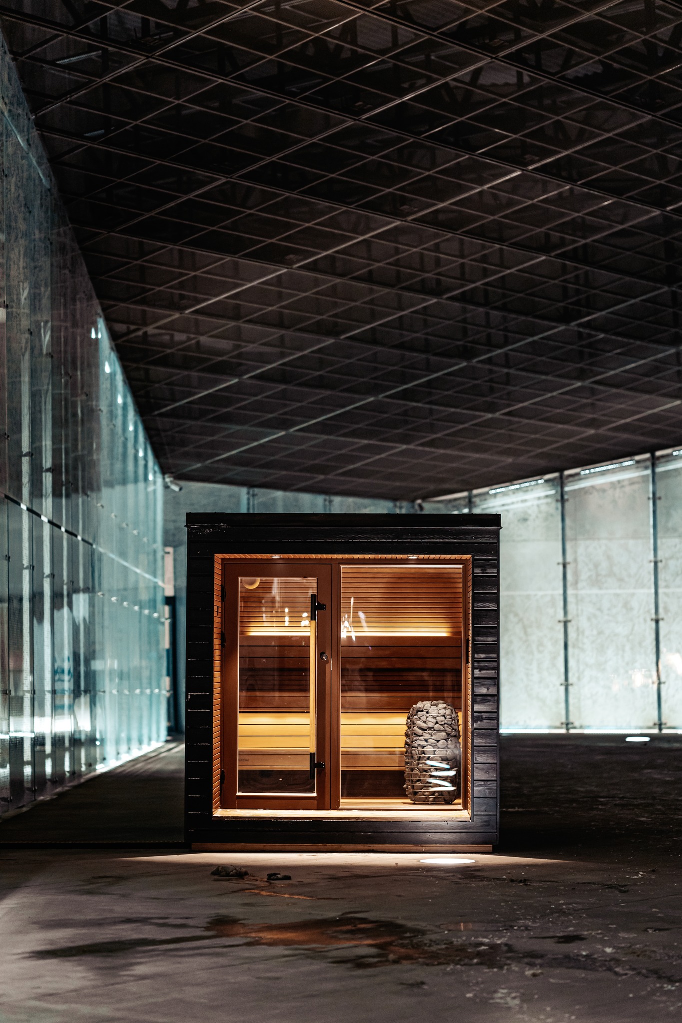 Auroom Arti high end sauna with large glass front window, terrace, and premium outdoor design