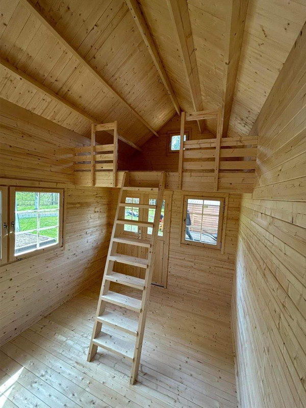 The Hudson Bunkie interior log cabin kit style bunkie with loft for guest space rental or cabin overflow