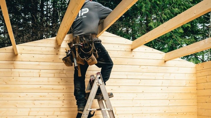Big Sky Cabin assembly step 6 roof boards being installed