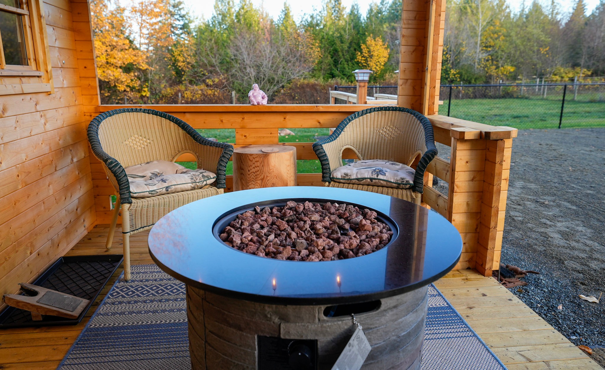 Fireplace on the covered porch of the Big Sky Cabin tiny cabin