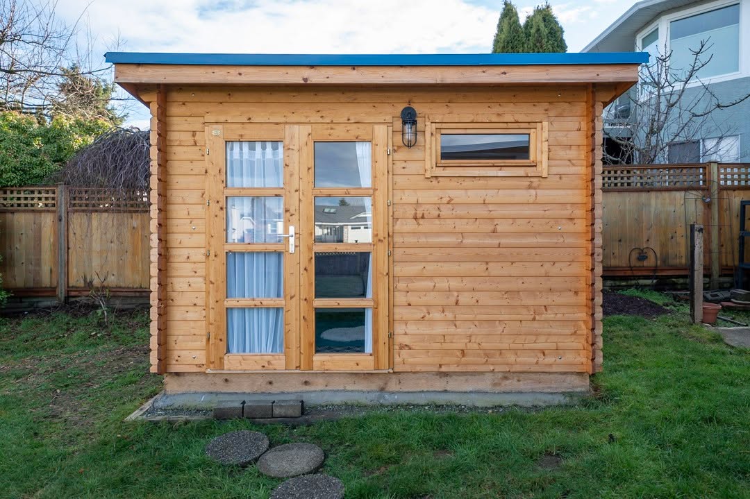 Silver State Studio wood shed with light stain finish