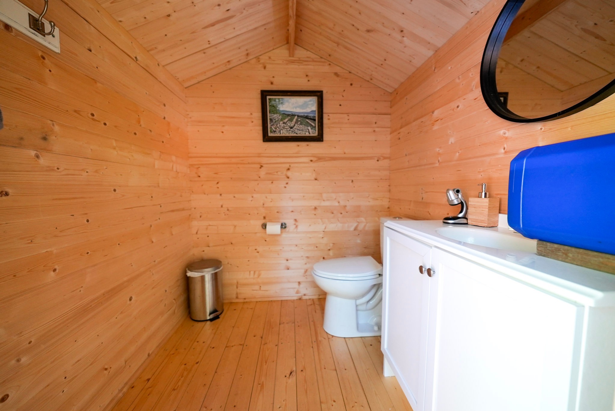 Finished small shed interior used as an outdoor bathroom space