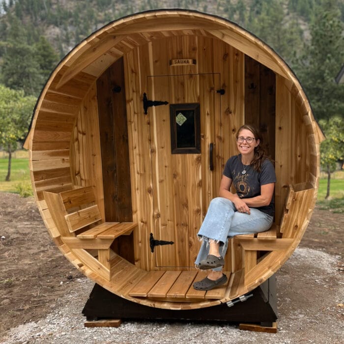 Portable wood-fired barrel sauna set up for off-grid wellness experience