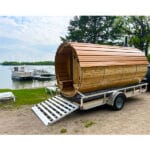 Luxury mobile sauna setup showing cold plunge, outdoor shower, and bundled wellness features