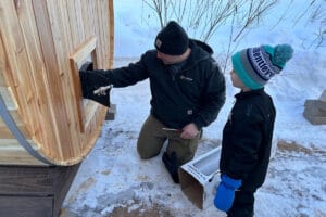 two persons using the Wood Stove Barrel Saunas