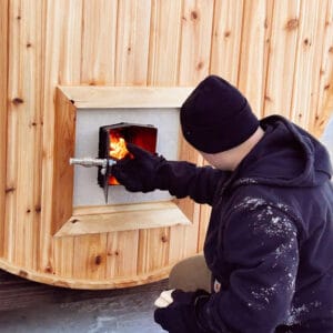 a person using Wood Stove Barrel Saunas!