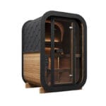 Two-person cube sauna with Thermo-Spruce exterior set in a modern backyard