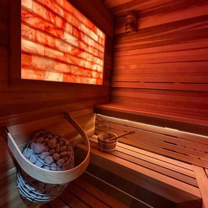 HUUM Drop electric heater photographed under soft sauna lighting