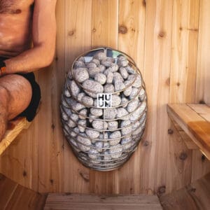 Top-down view of HUUM Drop heater filled with natural sauna rocks
