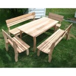 Side angle of durable Cedar Chickadee Dining Set, showcasing weather-resistant slats, contoured benches, and farmhouse style in this cedar furniture arrangement.