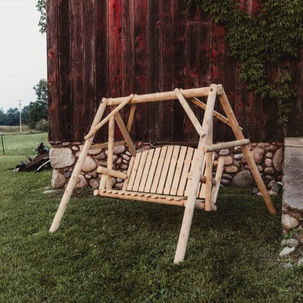 Rustic wood swing in garden setting
