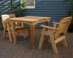 Side profile of durable Cedar Classic Dining Set, highlighting contoured chairs, wide armrests, and weather-resistant build in this wooden dining table set.