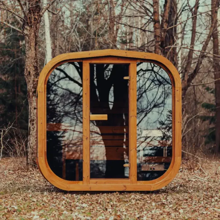 luxury cube sauna glowing at dusk