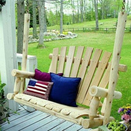 Cedar swing on porch with greenery