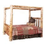 Cedar Log Canopy Bed displayed in a luxury rustic bedroom