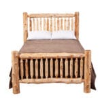 Small Spindle Bed shown in a cabin-style interior