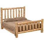 Footboard spindles of the traditional log bed in natural cedar finish