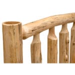 Head-on view of full-size log bed with bedding