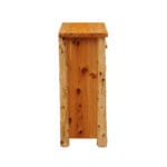 Close-up of handcrafted drawer handles on wooden chest