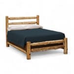 Cedar log headboard with vertical spindle design