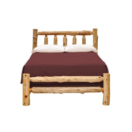 Footboard detail of log cabin bed frame with natural knots
