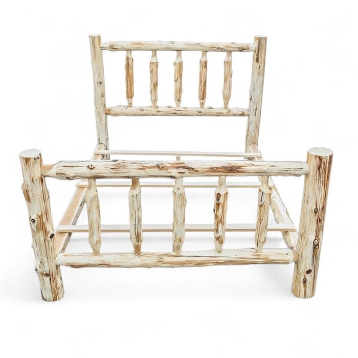 Headboard of unassembled cedar log bed frame with spindle design