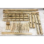 Close-up of hand-peeled cedar logs with natural knots