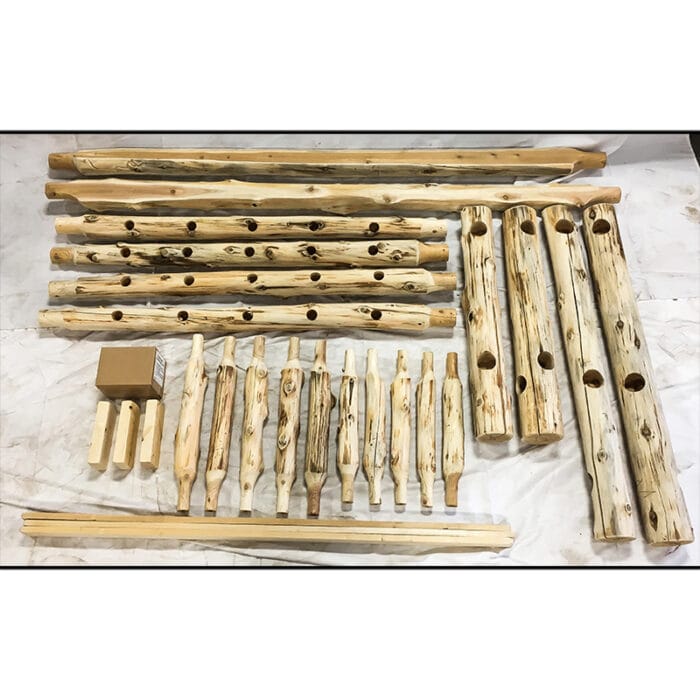 Close-up of hand-peeled cedar logs with natural knots