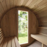 Panoramic glass front sauna offering modern Scandinavian design