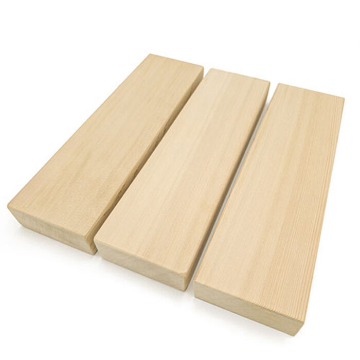 Close-up of clear cedar 2x4 lumber showing vertical grain pattern