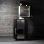 Traditional Finnish wood sauna heater installed inside sauna