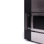 Wood-burning sauna heater producing steam with hot stones