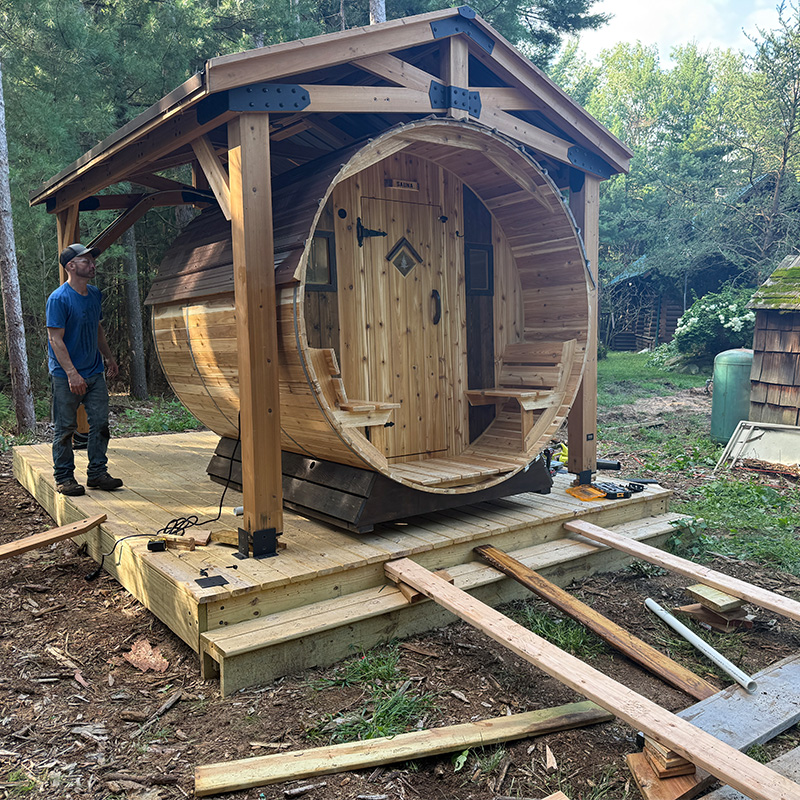 7' x 8' Setri barrel sauna in sunny spot with external stove