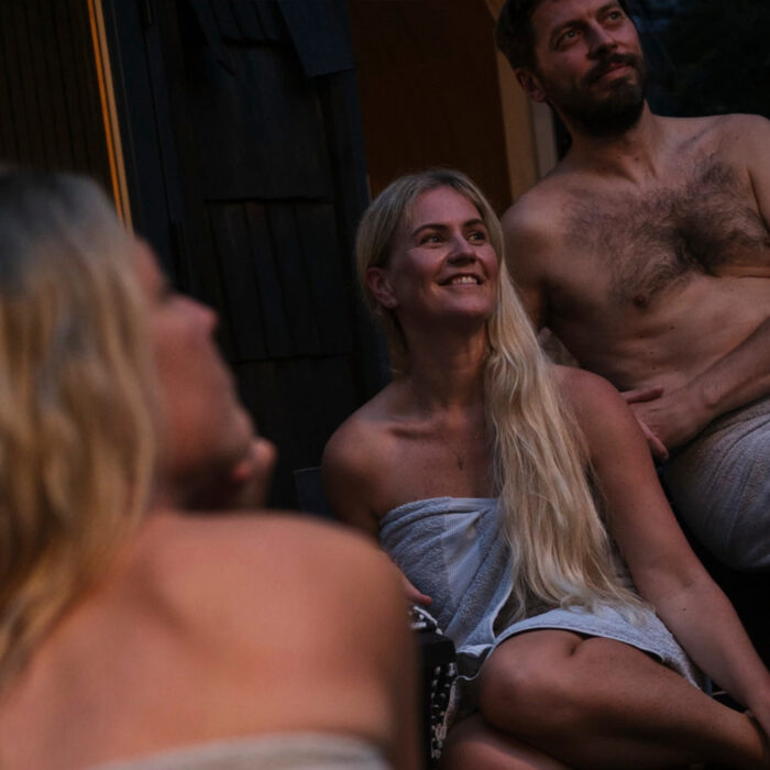 Traditional wood fired sauna heater inside a wooden sauna