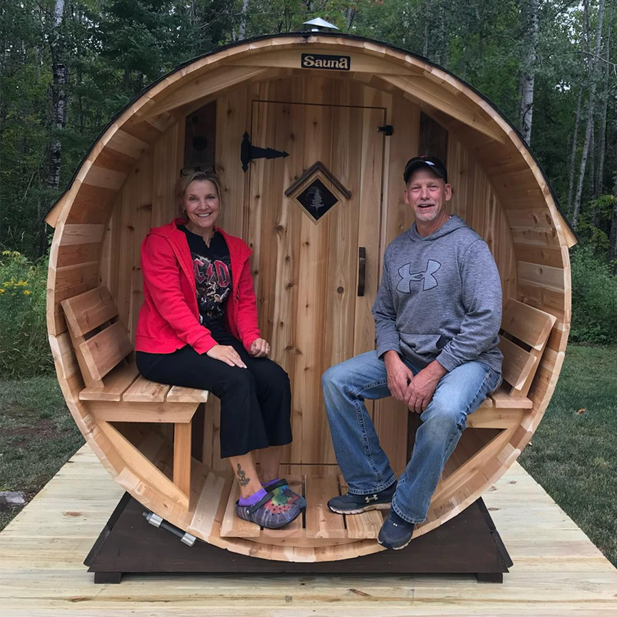 Customer enjoying steam in barrel sauna