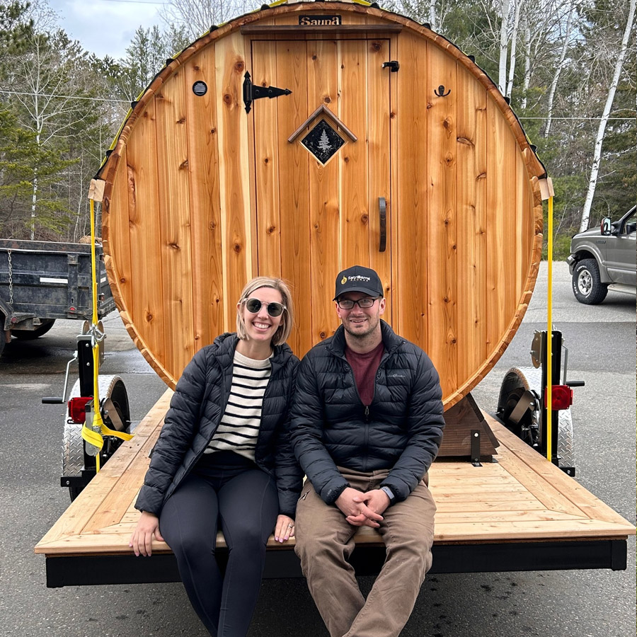 Relaxed customer inside Cedar Sense barrel sauna