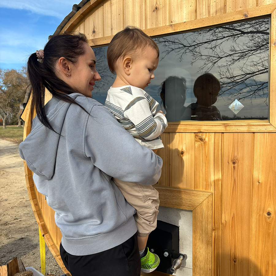 Family enjoying their new barrel sauna