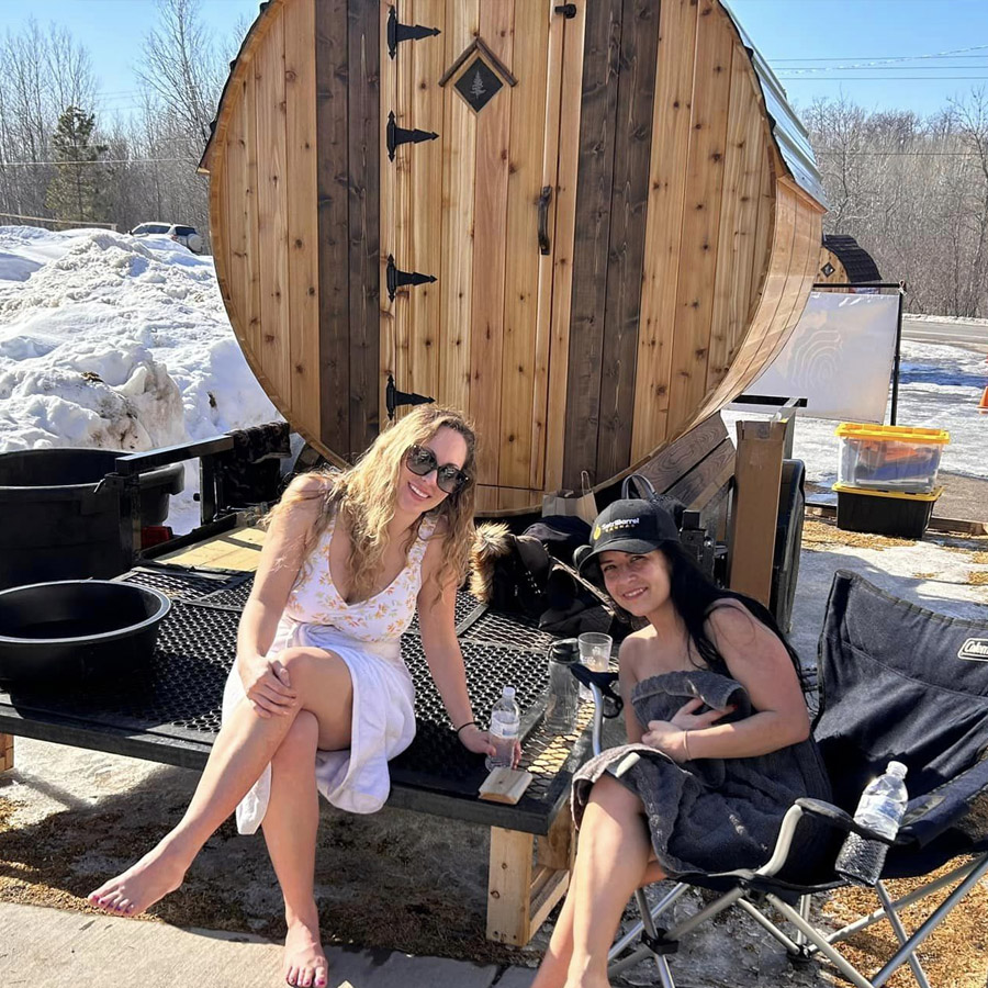 Family relaxing in their new barrel sauna
