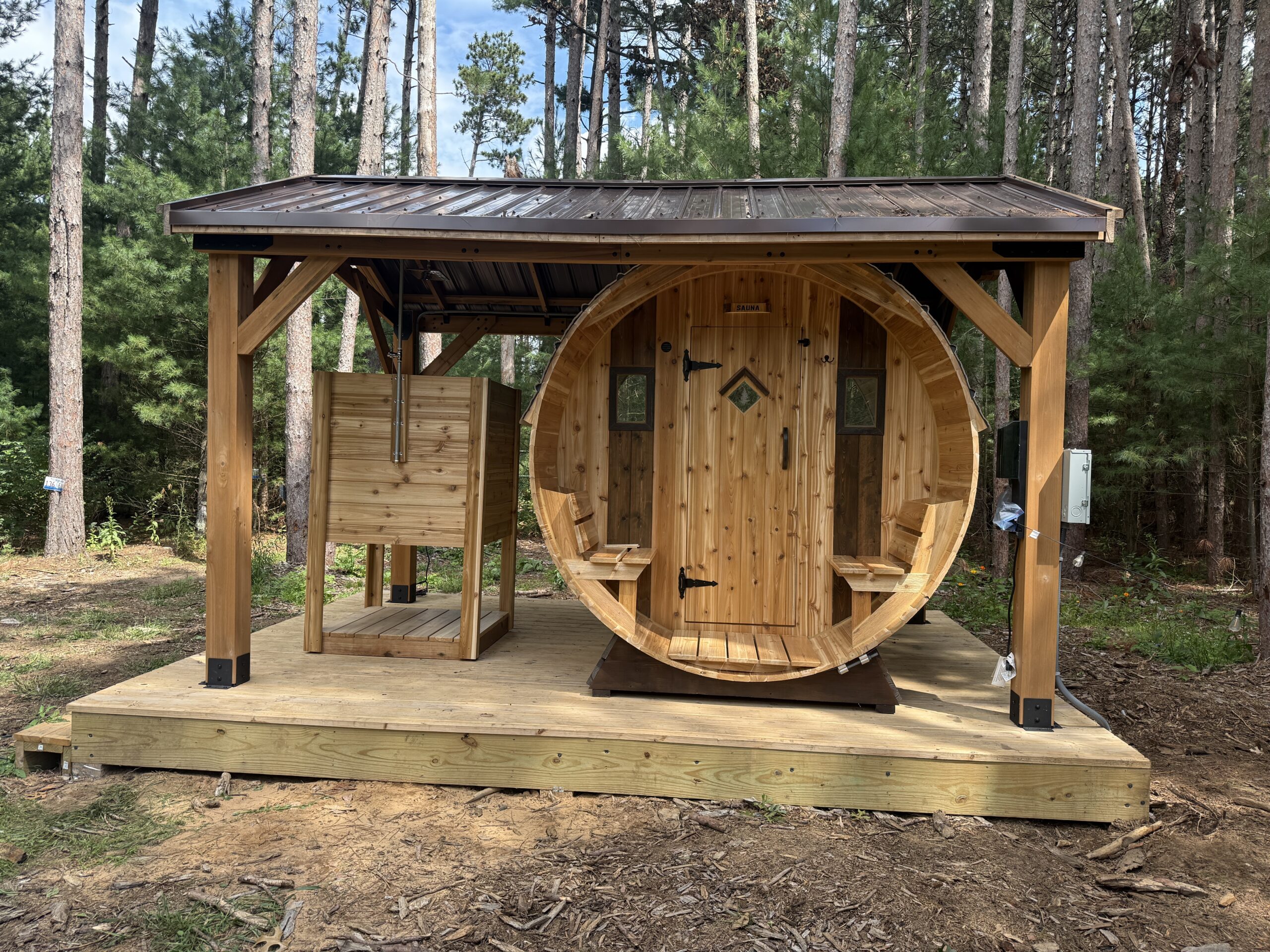 Covered front porch on 7' barrel sauna for privacy and relaxation