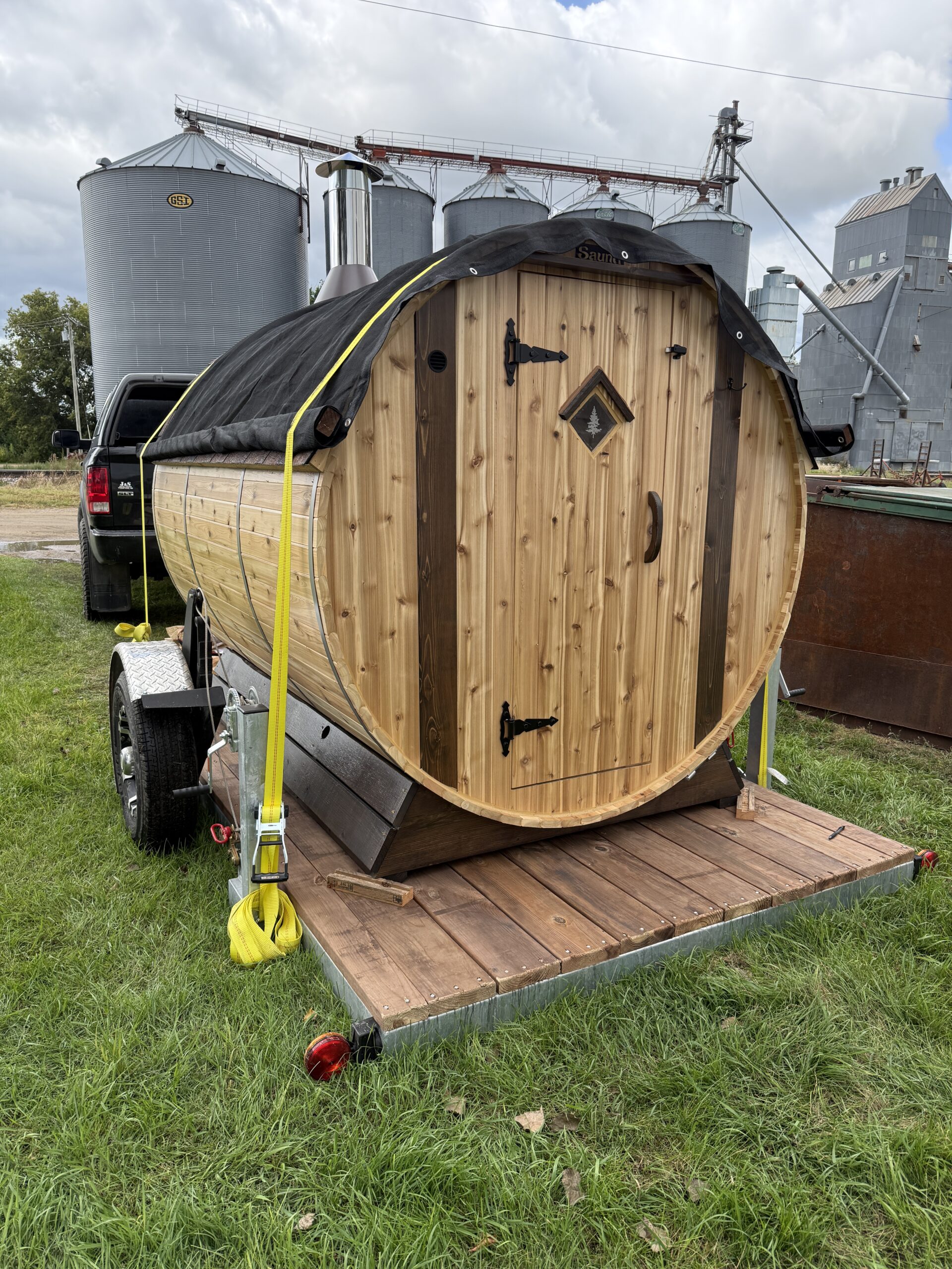 Cedar tone decked trailer with barrel sauna loaded