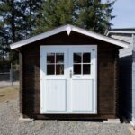 Compact wooden shed with finished exterior