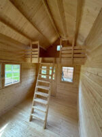 Hudson Bunkie interior with loft and wood walls