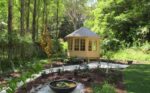 Grey backyard gazebo with modern pavilion design