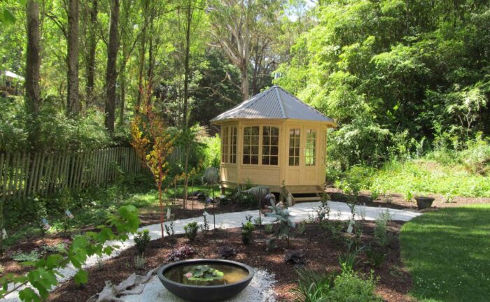 Grey backyard gazebo with modern pavilion design