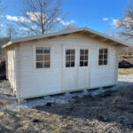 Blue painted room shed with white trim