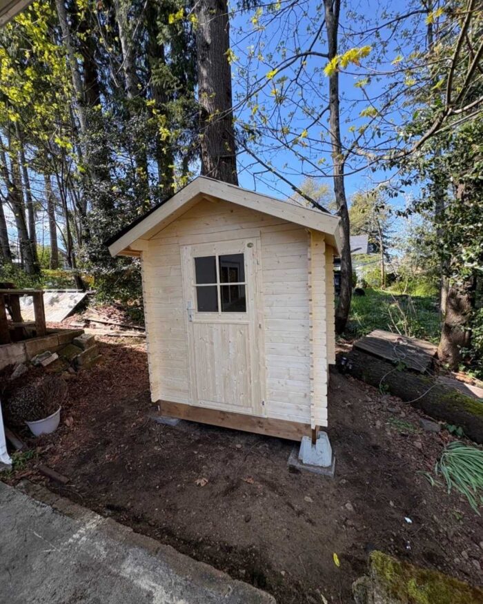 Small shed converted into a compact backyard sauna