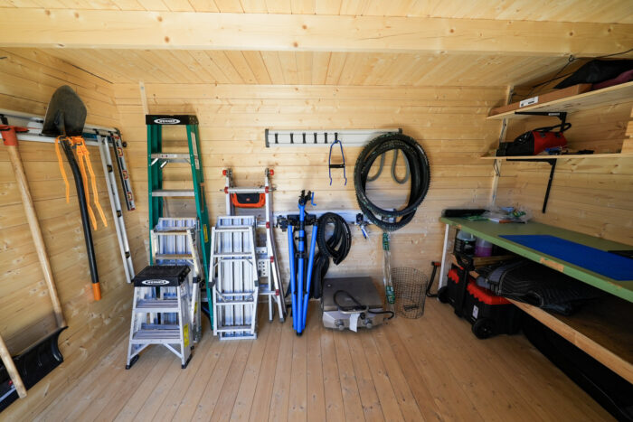 Outdoor storage shed interior with tools and equipment